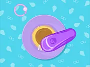 Summer Cookies free online cooking game screenshot showing baked cookies being decorated with colorful icing and sprinkles.