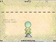 Keep The Balance free online game screen showing a precarious structure of stacked geometric blocks and shapes