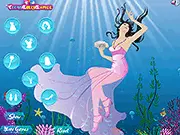 Screenshot of Aqua Girl Dress Up game showing a model wearing a turquoise dress and sea-themed accessories, standing on a beach background