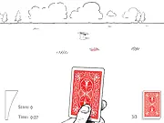 Card Toss free online game screen showing a hand aiming a playing card towards a hat target on a table