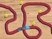 Screenshot of Emoticon Defense game showing several emoticons (towers) placed along a path shooting at small advancing enemy creeps.