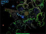 Asteroids Deluxe gameplay screenshot showing a vector graphics spacecraft shooting at triangular asteroids and an alien saucer
