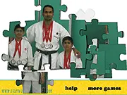 Karate Kids Jigsaw Puzzle free online game screenshot featuring martial arts kids in a fighting pose