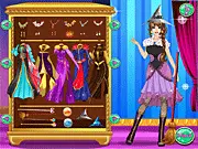 Wizard Fashionista Dress Up free online game screenshot. A beautiful female wizard character wearing an elegant magical dress and holding a staff.