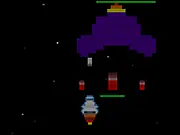 A heavily armed starship firing lasers while battling several alien fighter ships in the Star Voyager free online space shooter game.