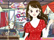 Dress Up Eliloes free online game screenshot, showing Eliloes, the bright summer star, wearing a lovely evening dress and stylish accessories