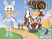Cute girl wearing a festive pastel dress and bunny ears in the Easter Dressup free online game.