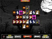 A screenshot of the Halloween Mahjong Connect game board, showing a grid of tiles with various Halloween-themed icons like candy corn, witch hats, and spooky eyes.