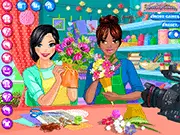 The Art and Craft Show Dress Up online game icon showing two smiling hosts, a man and a woman, standing ready to be styled with artistic backgrounds.