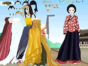 Dress-up game screen showing a character in a beautiful, colorful traditional Korean outfit (Hanbok) set against a temple background.