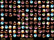 Cake Crunch game screen showing a grid filled with various colorful cakes, pastries, and sweet treats in the middle of a match-3 swap