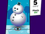 The gameplay screen of Christmas Decorate showing a decorated Christmas tree and a snowman, with various holiday items like bulbs and lights ready to be thrown