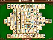 Screenshot of Mahjong 247 puzzle game showing stacks of traditional Chinese tiles on a wooden board, play free online game
