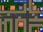 Aerial view of a busy city intersection where the player must place a stop sign to prevent two cars from crashing in the Crash Town 2 online game