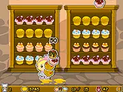Gameplay screenshot of Cake Collapse showing multiple layers of colorful cake stacked precariously high, with another cake layer falling into position from above.