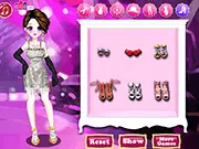 The main screen of the dress-up game Shiny Costumes Girl, showing the model with various glittering and shiny outfits and accessories to choose from