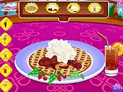 Gameplay screenshot of Waffle Decorating showing a perfectly styled waffle topped with whipped cream, fresh strawberries, chocolate sauce, and a tall glass of a colorful milkshake.