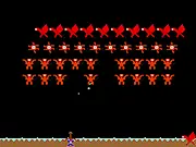 Free online arcade shooter game Monster Invaders Plus showing a defense turret firing at a group of monsters falling from the sky