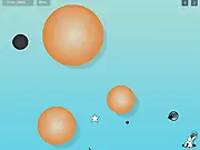 Baldrop game screenshot showing a ball launch trajectory affected by gravitational pull from other balls