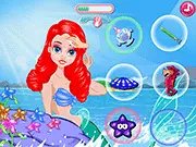 Screenshot of Mermaid Princess Face SPA game showing the mermaid receiving a luxurious facial mask treatment