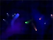 Electrons 2 free online physics puzzle game screenshot showing a player particle navigating around dangerous red and green particles towards a blue target particle.