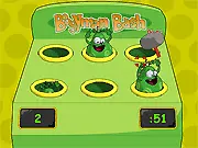 Free online Boogyman Bash game image, whacking a cartoon boogyman with a hammer in an arcade setting