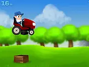 Mower Move free online game where a lawnmower navigates a field full of red rocks and brown boxes.
