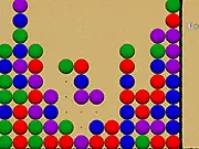 Screenshot of Bubble Buster Flash gameplay showing a launcher aiming a yellow bubble at a dense cluster of red, blue, and yellow bubbles at the top of the screen in the free online puzzle game.