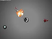 Shape Defence free online game screenshot showing a central tower shooting lines at geometric shape enemies.