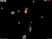 Rock-Bam Space Shooter free online game screenshot showing a spaceship shooting at various colored meteors in space