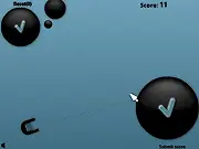 Screenshot of the Trigger Ball game showing a cannon aiming a shot around a set of obstacles towards a circular target.