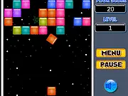 Screenshot of Space Brick, a free online puzzle shooter game, showing a cannon aiming at geometric blocks on a space-themed board