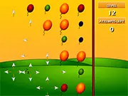 Balloon Blast puzzle game screenshot showing various colored balloons arranged on a grid, ready for the chain reaction to start.