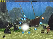 Ballarium physics puzzle game screenshot showing small balls rolling toward colorful gems while trying to avoid a black bomb on the screen.