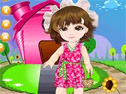 Screenshot of Bersh Baby Dressup online game, showing a cute little girl wearing a pink dress and holding a matching bag