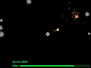 Cosmo Boom free online shooter game screen showing a spaceship defending itself by shooting large and small asteroids in space