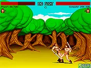 Savage Fight free online game screenshot showing two barbarians engaged in a fierce sword fight duel on a desert battleground