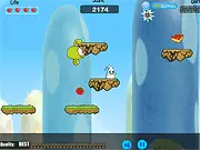 Gameplay screen of the Bean's Big Adventure free online platformer, showing the small bean hero jumping on a platform with enemies and collectible food nearby.