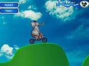 Elephant Bike Stunts game featuring a large elephant riding a motorcycle across a challenging, jagged race track