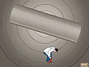 Screenshot of Skater Boy free online game featuring a skateboarder jumping over a series of obstacles in a 2D tunnel or road environment.