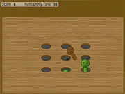 Caterpillar Smash game screen showing a hand about to tap and crush a green caterpillar for points