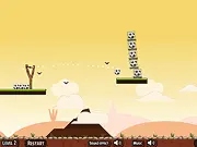 Screenshot of Slingshot Soccer Ball game showing a soccer ball in a slingshot targeting a stack of other balls arranged on a platform.