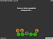 Screenshot of the free online puzzle game Pumpkin Remover 2 showing fresh and rotten pumpkins balanced on wooden blocks