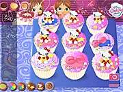 Custom Cartoon Cupcakes decorating game screenshot showing a selection of finished colorful cupcakes with cute cartoon faces - PlayArcadeHub