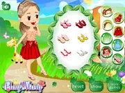 Screenshot of the Fairy Place Dress Up online game featuring a girl character standing in a magical forest setting with various fantasy clothes and accessories around her.