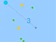 Screenshot of Sproing! showing the blue orb connected by a spring-like line to the mouse cursor, surrounded by green and various colored enemy orbs