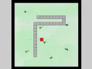 The classic retro game Snake-Like showing a long pixelated snake moving across a grid, chasing a small piece of food