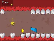Screenshot from the free online game Terrible Teeth showing Cornelius the corn kernel dodging massive, crushing teeth and toxic liquids inside a grotesque monster's mouth.