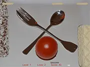 Screenshot of Delicious Bricks online game showing a candy paddle hitting a tomato ball towards blocks of various colorful candies.