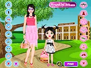 Screenshot of Mother & Daughter Dressup free online game, showing a mother and daughter standing side-by-side in matching adorable outfits.